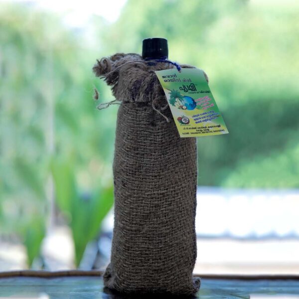 Premium 1L glass bottle of Jawan Prithvi pure coconut oil with eco-friendly jute pack